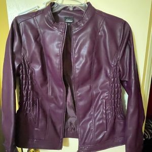 Faux leather jacket.  Very soft and good for dress up or casual.